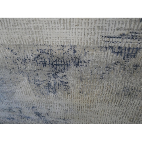 1515 - An ivory ground designer rug with hints of duck egg blue and grey, 3m x 2m