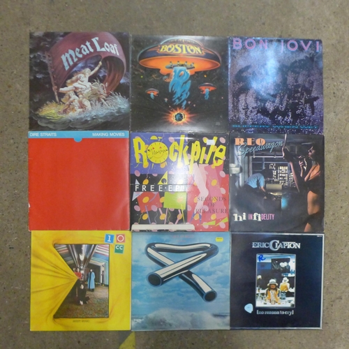 2109 - An assortment of 30 rock LP records in a protective case including Bon Jovi, Meatloaf, Dire Straits,... 