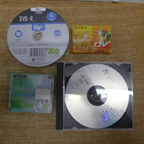 2120 - A large quantity of DVD-RW re-writable blank compact discs, 21 Sony 60 LP 90 mini DV cassette tapes,... 