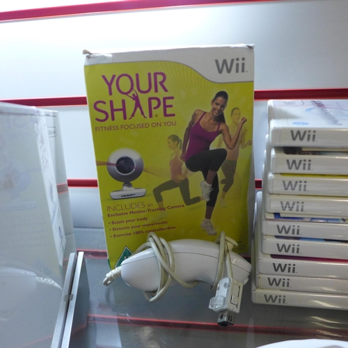 2141 - A Nintendo Wii console with cables and Wii fit board with silicone sleeve, two Nintendo Wii wireless... 