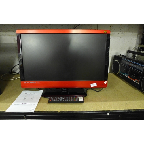 2151 - A Technika X23/50E-BR-FTCDUP 23” LCD TV with integrated DVD player, remote and instructions - W