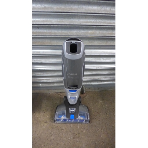 2190 - A Vax One PWR cordless all in one multi-surface hard floor cleaner, spare battery and rinse storage ... 