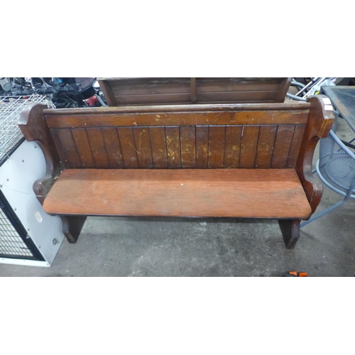 2209 - A wooden church pew garden bench