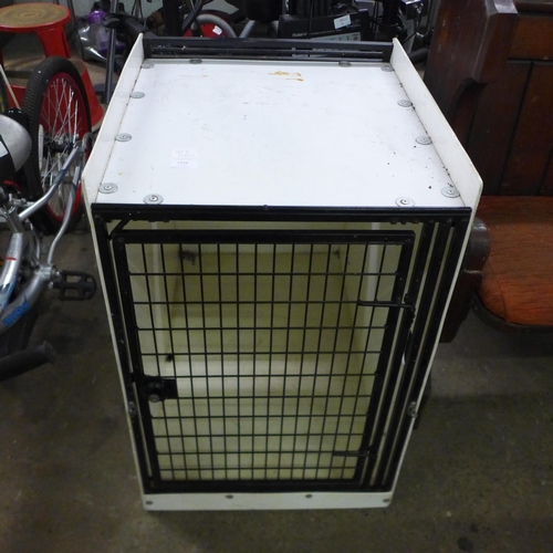 2210 - A dog cage and a Lintran transit box