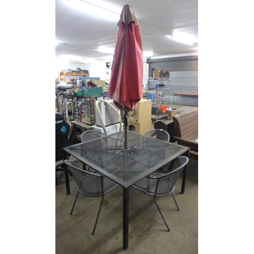 2212 - A four piece metal garden dining set; four chairs, table and parasol