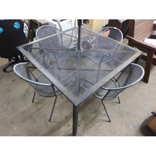 2212 - A four piece metal garden dining set; four chairs, table and parasol