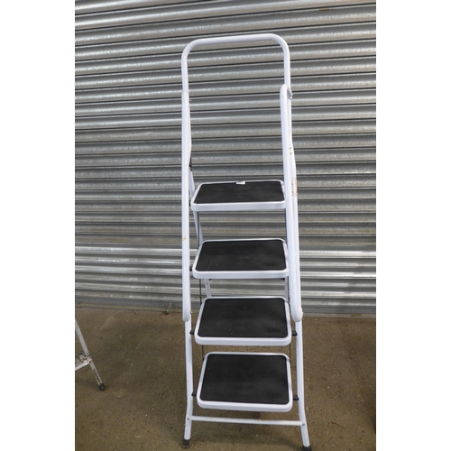 2224 - A set of five rung and four rung step ladders and one other set of steps