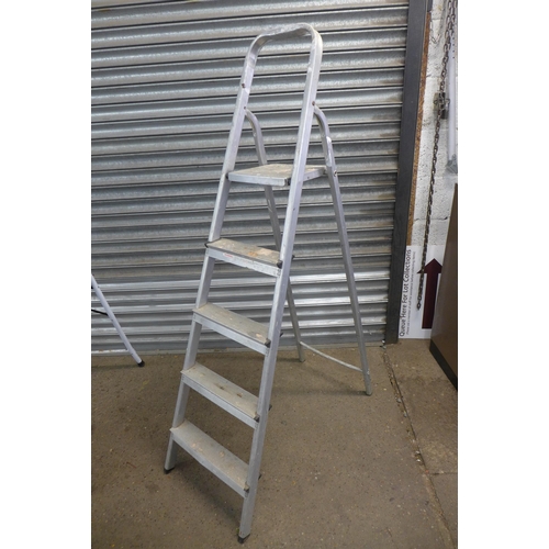 2224 - A set of five rung and four rung step ladders and one other set of steps