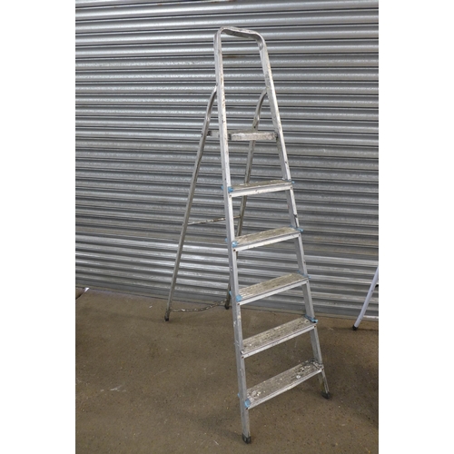 2224 - A set of five rung and four rung step ladders and one other set of steps