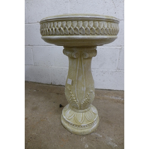 2288 - A sandstone effect concrete two piece bird bath