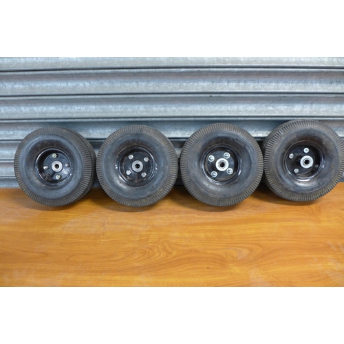 2338 - A set of four pneumatic trolley wheels and tyres