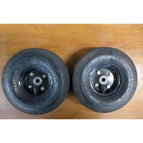 2338 - A set of four pneumatic trolley wheels and tyres