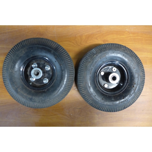 2338 - A set of four pneumatic trolley wheels and tyres