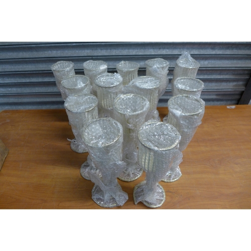 2351 - A large quantity of metal candle holders