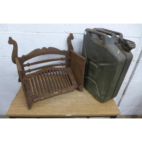 2357 - A cast iron fire grate and a metal vintage jerry can