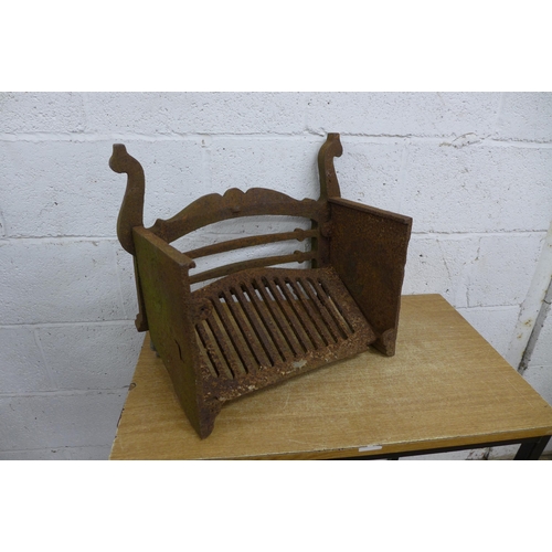 2357 - A cast iron fire grate and a metal vintage jerry can