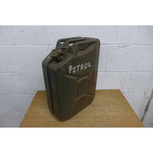 2357 - A cast iron fire grate and a metal vintage jerry can