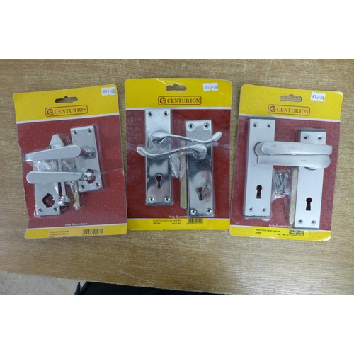 2361 - A box of door furniture, most sealed in packets, handles, knobs, etc.