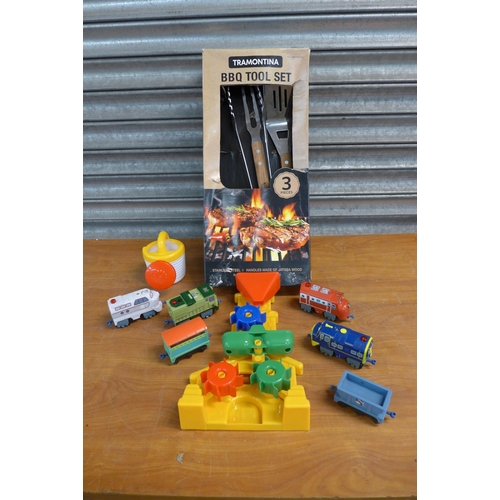 2399 - A model train set with track, sandcastle toys, etc. and a 3 piece Tramontina barbecue tool set