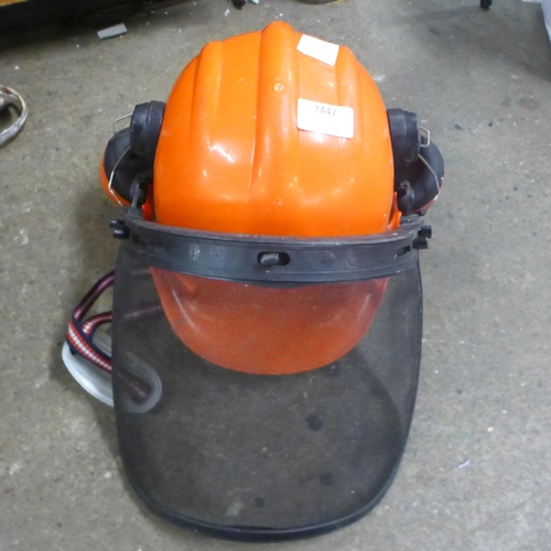 2447 - A site helmet, ear defenders, two plasterer's whisks, Stanley stapler and two drill bits