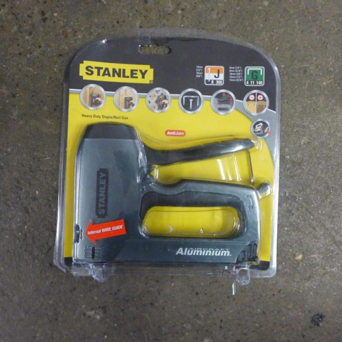 2447 - A site helmet, ear defenders, two plasterer's whisks, Stanley stapler and two drill bits