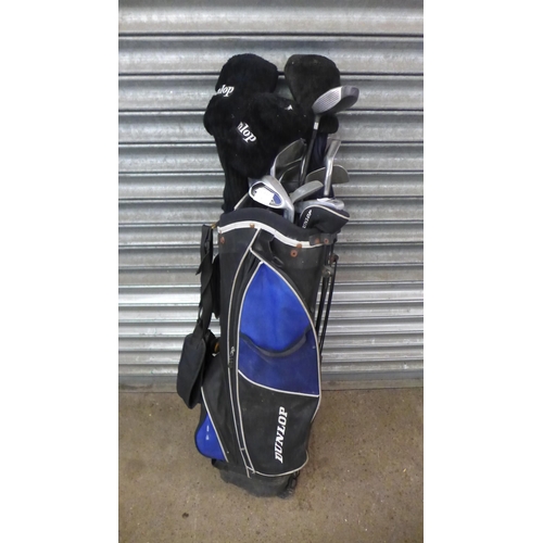 2486 - A set of Dunlop golf clubs and bag