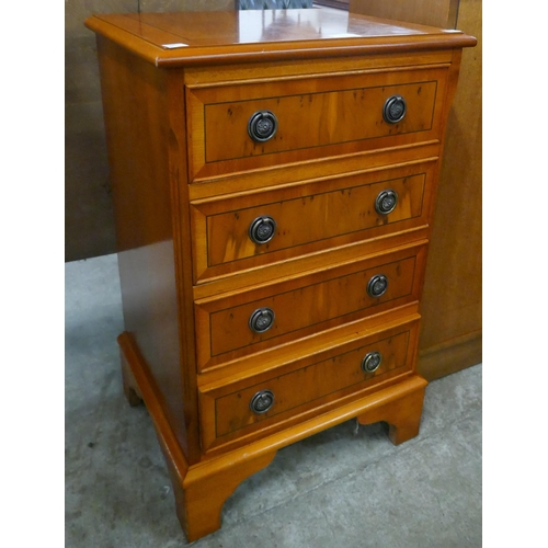 111 - A small George III style inlaid yew wood chest of drawers