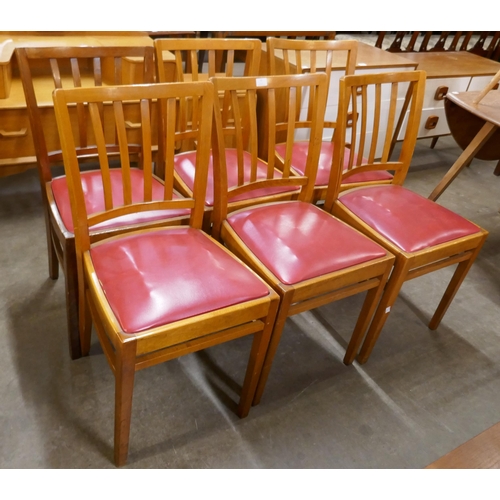 73 - A set of six beech and red leather chairs