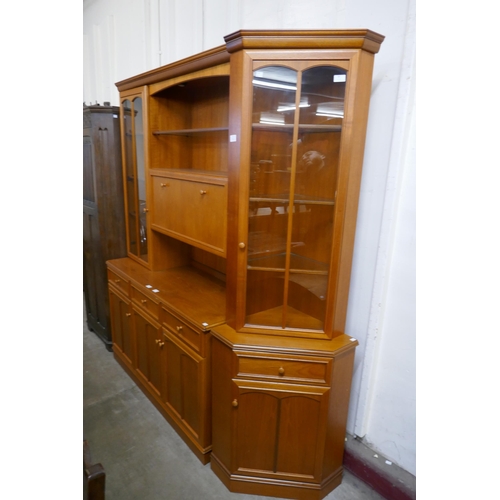 87A - A Stag teak room divider and a corner cabinet