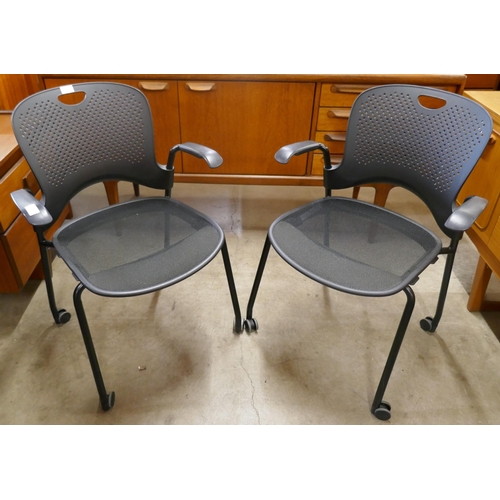 98 - A pair of Herman Miller Caper black metal and Perspex desk chairs