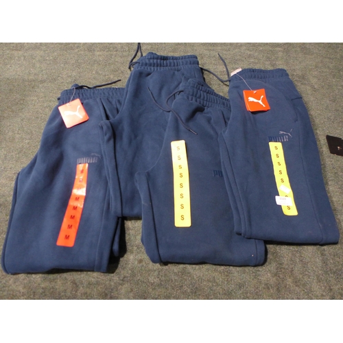 3169 - Four pairs of Men's Marine Blue Puma joggers - Sizes: S & M *This lot is subject to VAT