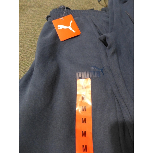 3169 - Four pairs of Men's Marine Blue Puma joggers - Sizes: S & M *This lot is subject to VAT