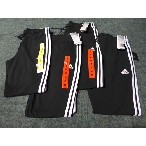 3170 - Four pairs of Men's Black Adidas slim pants - Sizes: S & M *This lot is subject to VAT