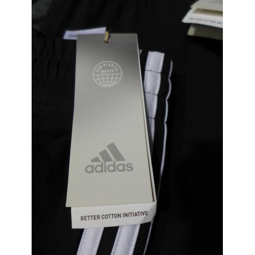 3170 - Four pairs of Men's Black Adidas slim pants - Sizes: S & M *This lot is subject to VAT