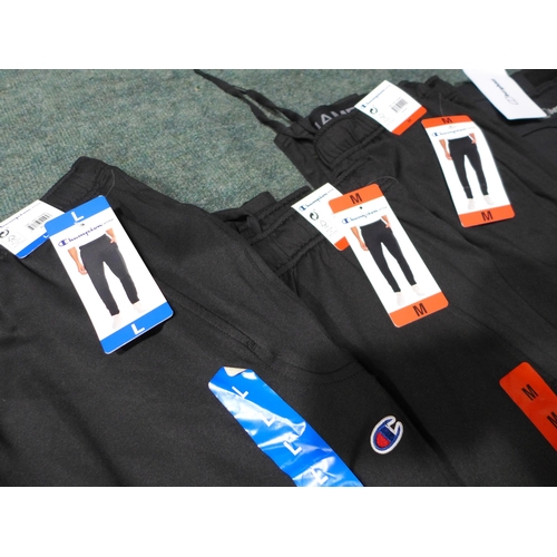 3171 - Four Pairs of Men's Black joggers - Champion and Berghaus - mixed sizes *This lot is subject to VAT