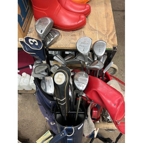 2472 - 3 Bags of golf clubs; 1 Magregor, a Taylormade bag, a blue bag with golf clubs, an electric caddy an... 