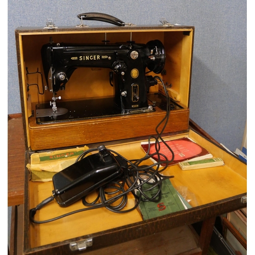 415 - A cased Singer electric sewing machine