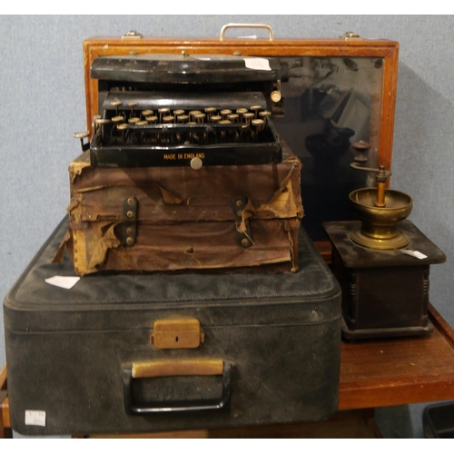 416 - A display case, two typewriters and a coffee grinder