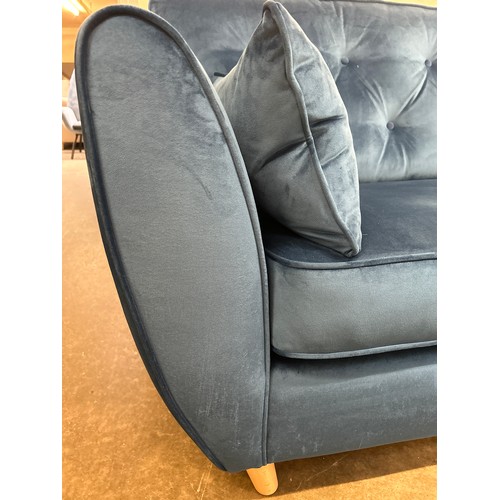 1398 - A blue velvet Hoxton three seater sofa RRP £799