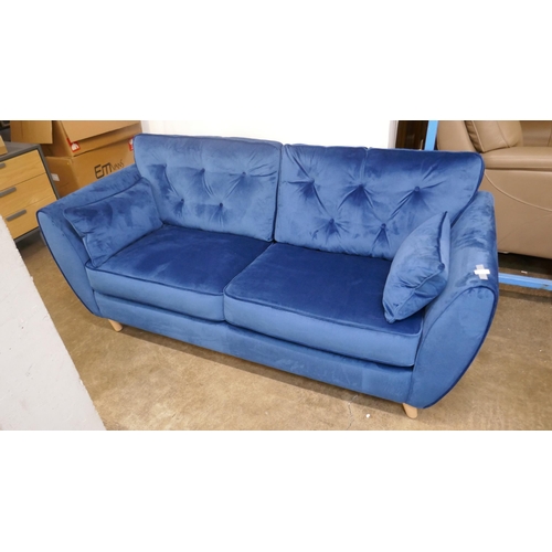 1398 - A blue velvet Hoxton three seater sofa RRP £799