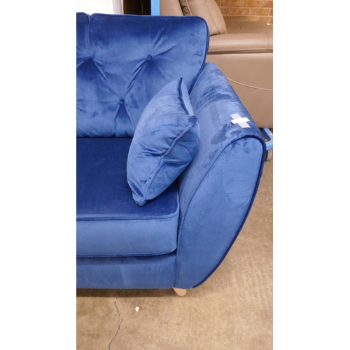 1398 - A blue velvet Hoxton three seater sofa RRP £799