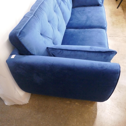 1398 - A blue velvet Hoxton three seater sofa RRP £799