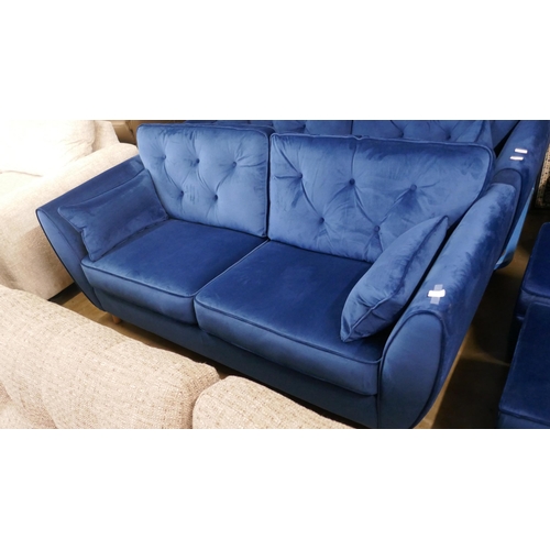 1398 - A blue velvet Hoxton three seater sofa RRP £799