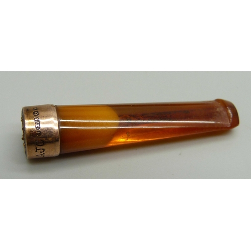 1010 - A cheroot holder with a 9ct gold mount, cased, case a/f