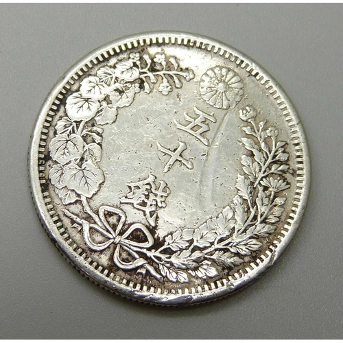 1029 - A Chinese silver 50 Sen coin