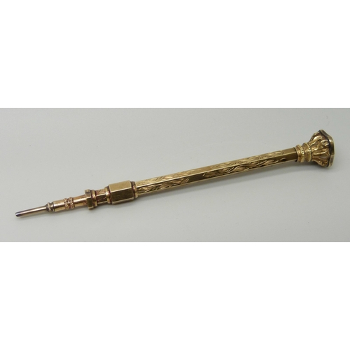 1030 - A gold tone propelling pencil with agate stone detail