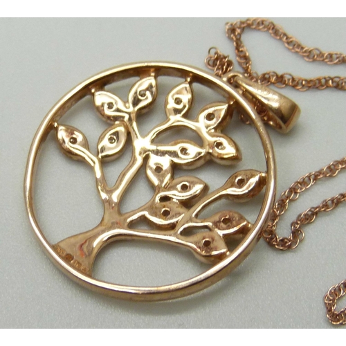 1034 - A 9ct rose gold pendant with tree of life design set with fourteen small diamonds, on a 9ct rose gol... 