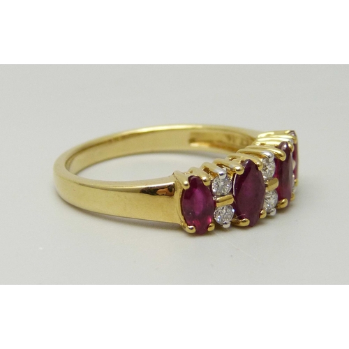 1037 - An 18ct yellow gold ring set with four marquise cut rubies and six round brilliant cut diamonds, app... 