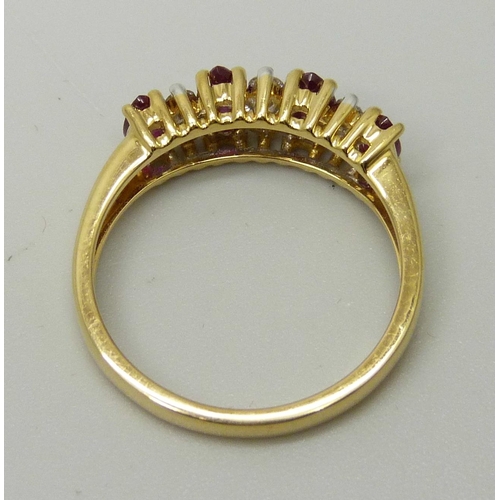 1037 - An 18ct yellow gold ring set with four marquise cut rubies and six round brilliant cut diamonds, app... 