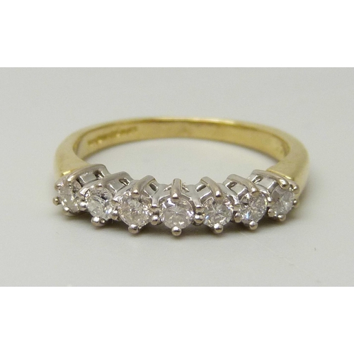 1038 - An 18ct yellow gold ring set with seven round brilliant cut diamonds, approximately 0.33ct, I/J colo... 